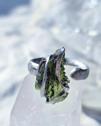 Adjustable ring with a genuine 1.23 g transparent green raw Moldavite from Chlum, Czech Republic, set in lead-free jewellery tin with silver admixture.