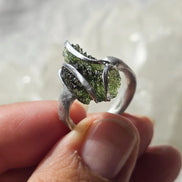 Adjustable ring with a genuine 1.23 g transparent green raw Moldavite from Chlum, Czech Republic, set in lead-free jewellery tin with silver admixture.
