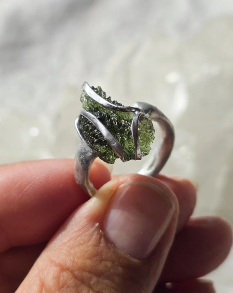 Adjustable ring with a genuine 1.23 g transparent green raw Moldavite from Chlum, Czech Republic, set in lead-free jewellery tin with silver admixture.
