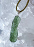 Transparent 3.6g Chlum Moldavite pendant with natural sculpted surface in sterling silver setting.