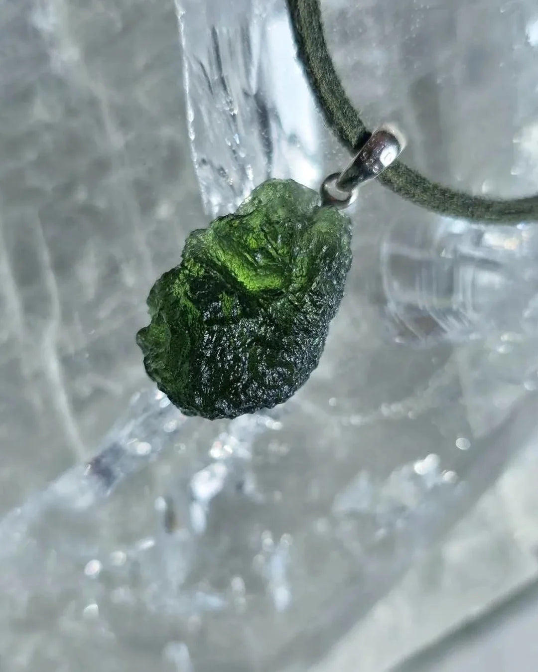 Sterling silver pendant with 3.8 g transparent pure green Moldavite from Chlum, Czech Republic.