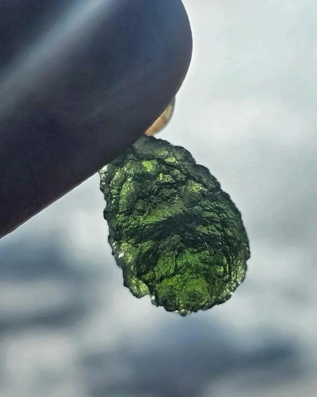 Sterling silver pendant with 3.8 g transparent pure green Moldavite from Chlum, Czech Republic.