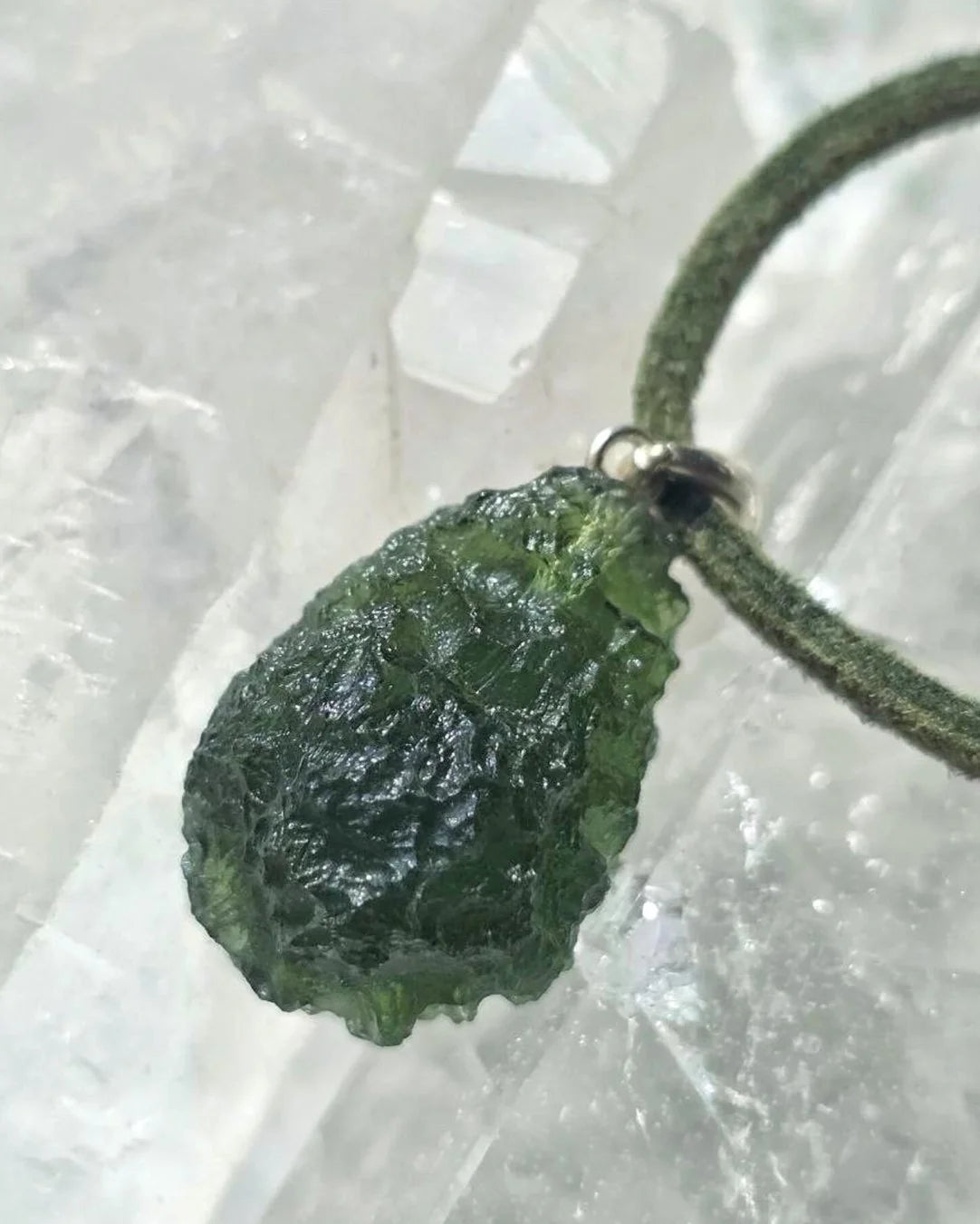 Sterling silver pendant with 3.8 g transparent pure green Moldavite from Chlum, Czech Republic.