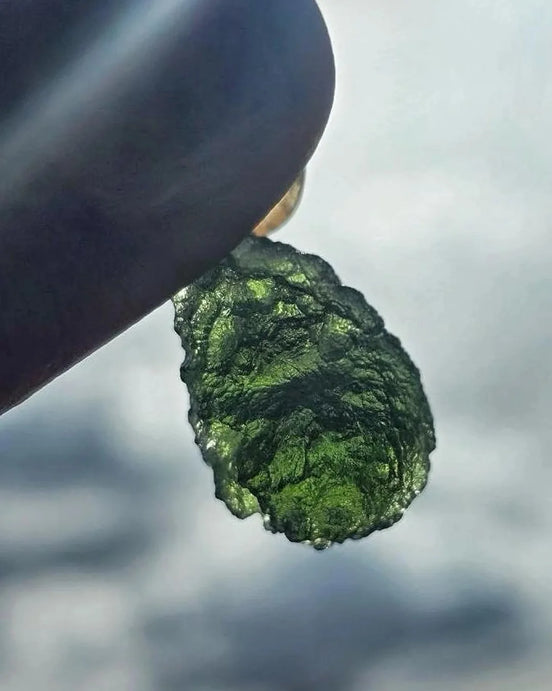 Sterling silver pendant with 3.8 g transparent pure green Moldavite from Chlum, Czech Republic.