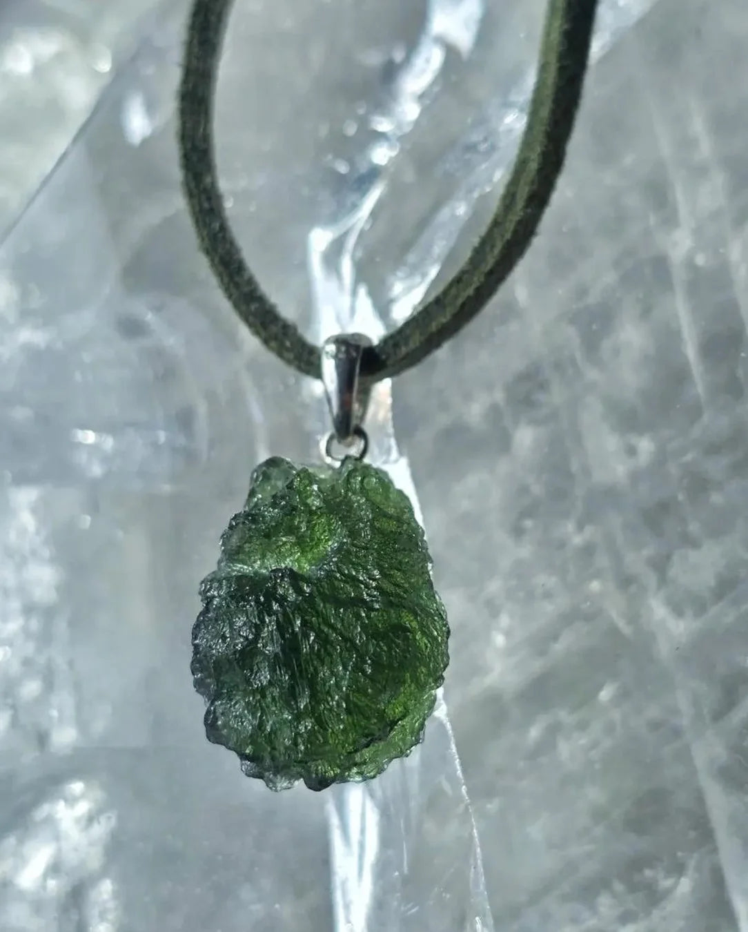 Sterling silver pendant with 3.8 g transparent pure green Moldavite from Chlum, Czech Republic.