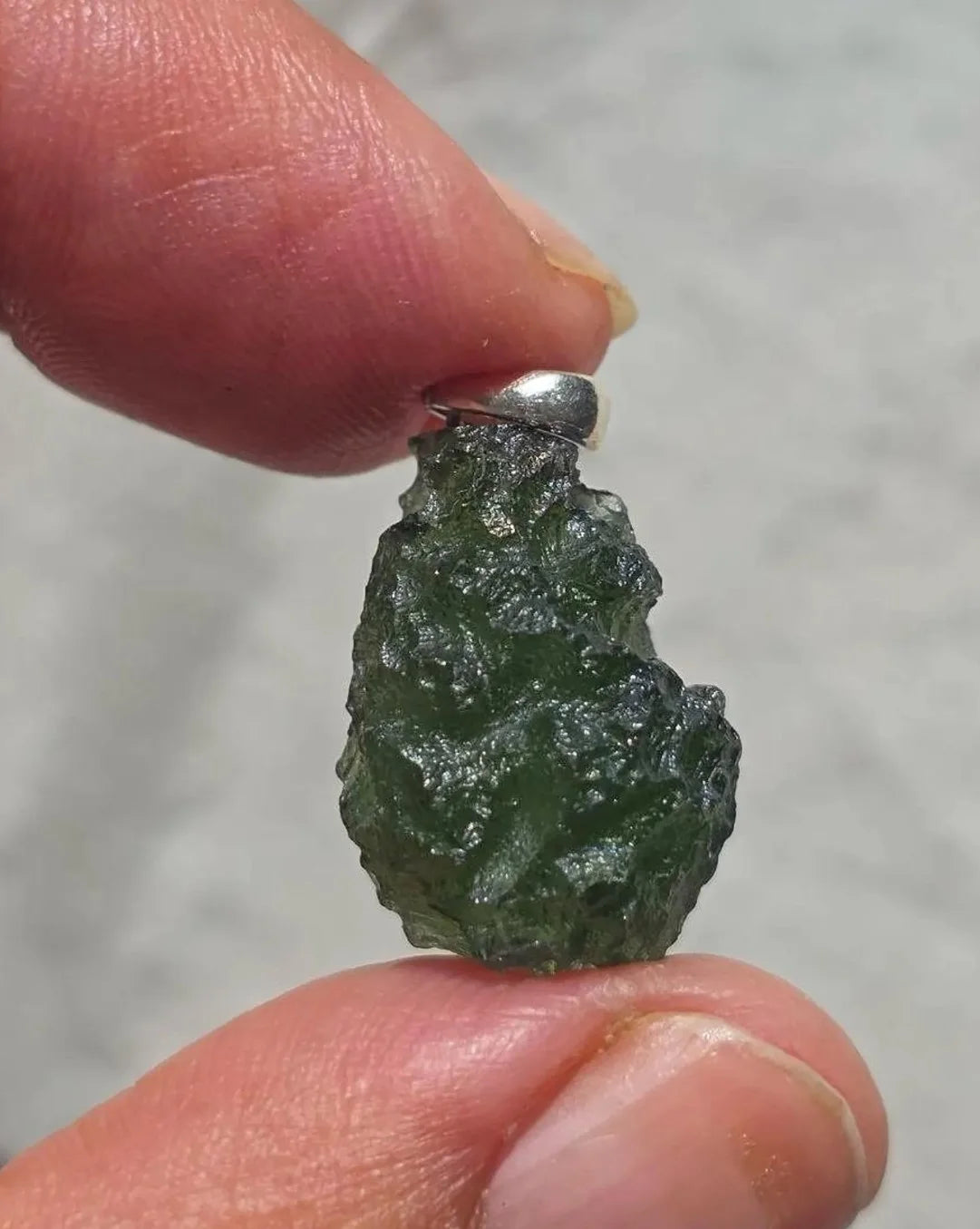 Sterling silver pendant with 3.8 g transparent pure green Moldavite from Chlum, Czech Republic.
