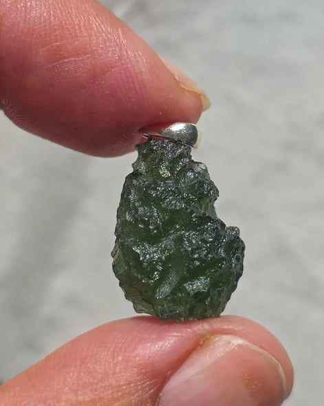 Sterling silver pendant with 3.8 g transparent pure green Moldavite from Chlum, Czech Republic.