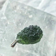 Sterling silver pendant with 3.8 g transparent pure green Moldavite from Chlum, Czech Republic.