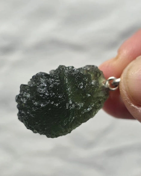 Sterling silver pendant with 3.8 g transparent pure green Moldavite from Chlum, Czech Republic.