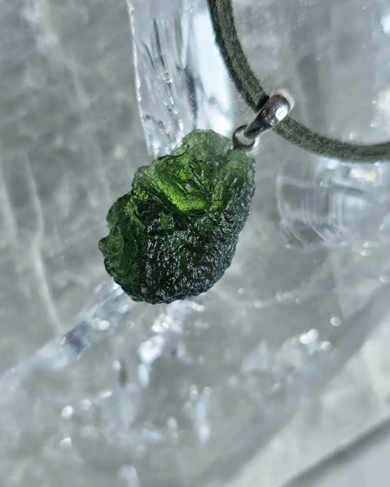 Sterling silver pendant with 3.8 g transparent pure green Moldavite from Chlum, Czech Republic.