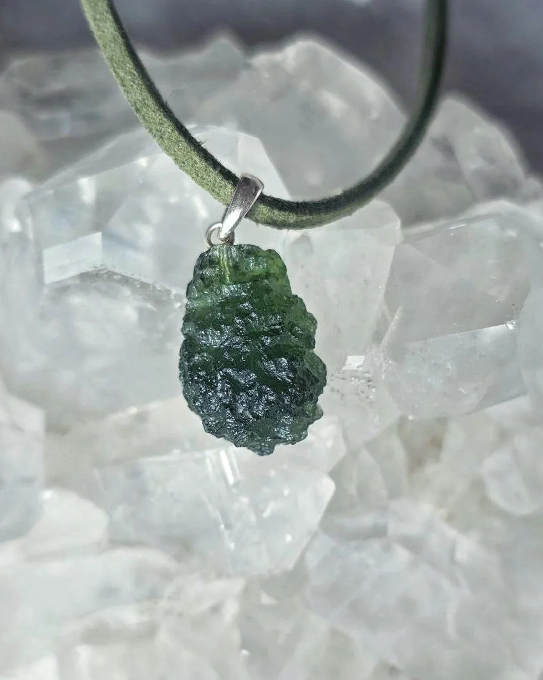 Sterling silver pendant with 3.8 g transparent pure green Moldavite from Chlum, Czech Republic.