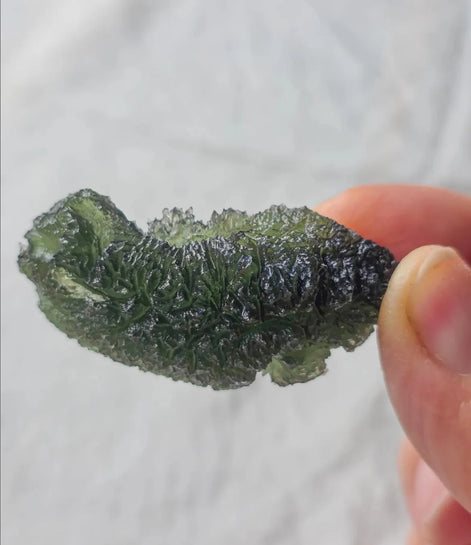 Large 20.74g pure green Moldavite from Nesměň les, Czech Republic with natural deep spiked sculpting
