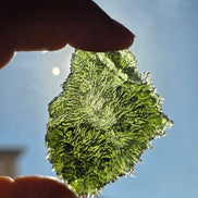 Large 25.16g natural green Moldavite from Malý Chlum, Czech Republic with deep sculpted surface