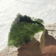 Large 25.16g natural green Moldavite from Malý Chlum, Czech Republic with deep sculpted surface