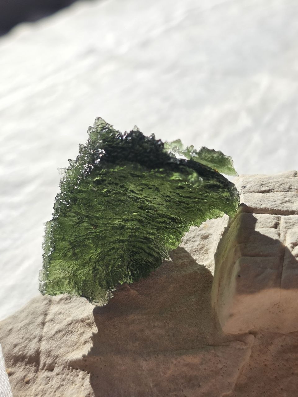 Large 25.16g natural green Moldavite from Malý Chlum, Czech Republic with deep sculpted surface
