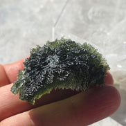 Large 25.16g natural green Moldavite from Malý Chlum, Czech Republic with deep sculpted surface