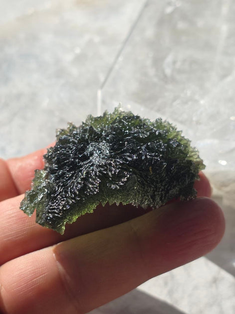 Large 25.16g natural green Moldavite from Malý Chlum, Czech Republic with deep sculpted surface