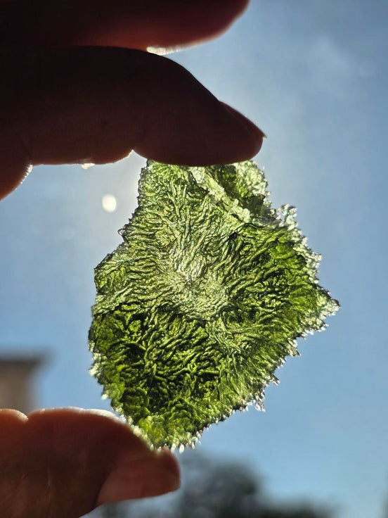 Large 25.16g natural green Moldavite from Malý Chlum, Czech Republic with deep sculpted surface