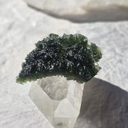 Large 25.16g natural green Moldavite from Malý Chlum, Czech Republic with deep sculpted surface