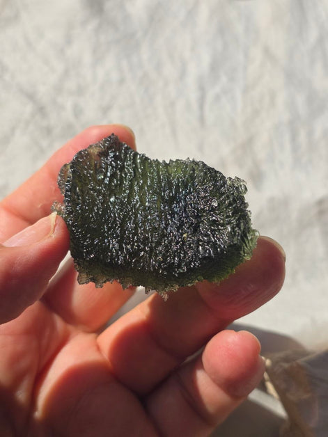 Large 25.16g natural green Moldavite from Malý Chlum, Czech Republic with deep sculpted surface