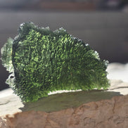 Large 25.16g natural green Moldavite from Malý Chlum, Czech Republic with deep sculpted surface