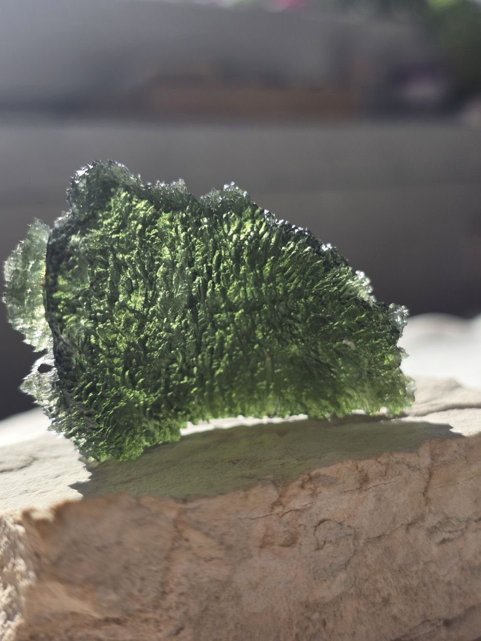 Large 25.16g natural green Moldavite from Malý Chlum, Czech Republic with deep sculpted surface