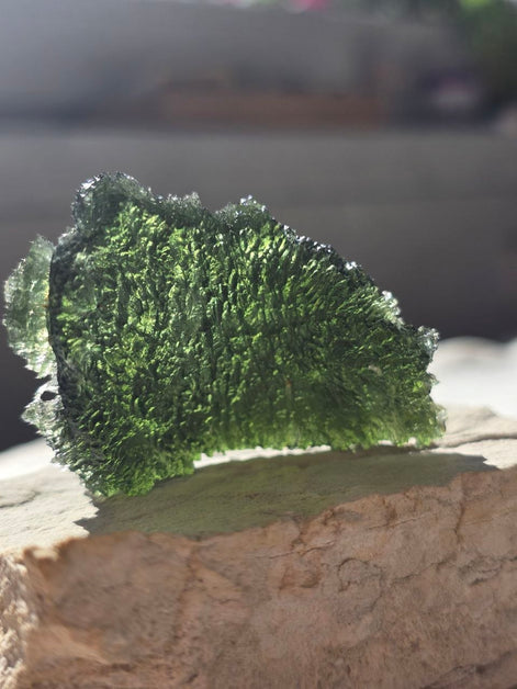 Large 25.16g natural green Moldavite from Malý Chlum, Czech Republic with deep sculpted surface