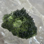 Large 25.16g natural green Moldavite from Malý Chlum, Czech Republic with deep sculpted surface