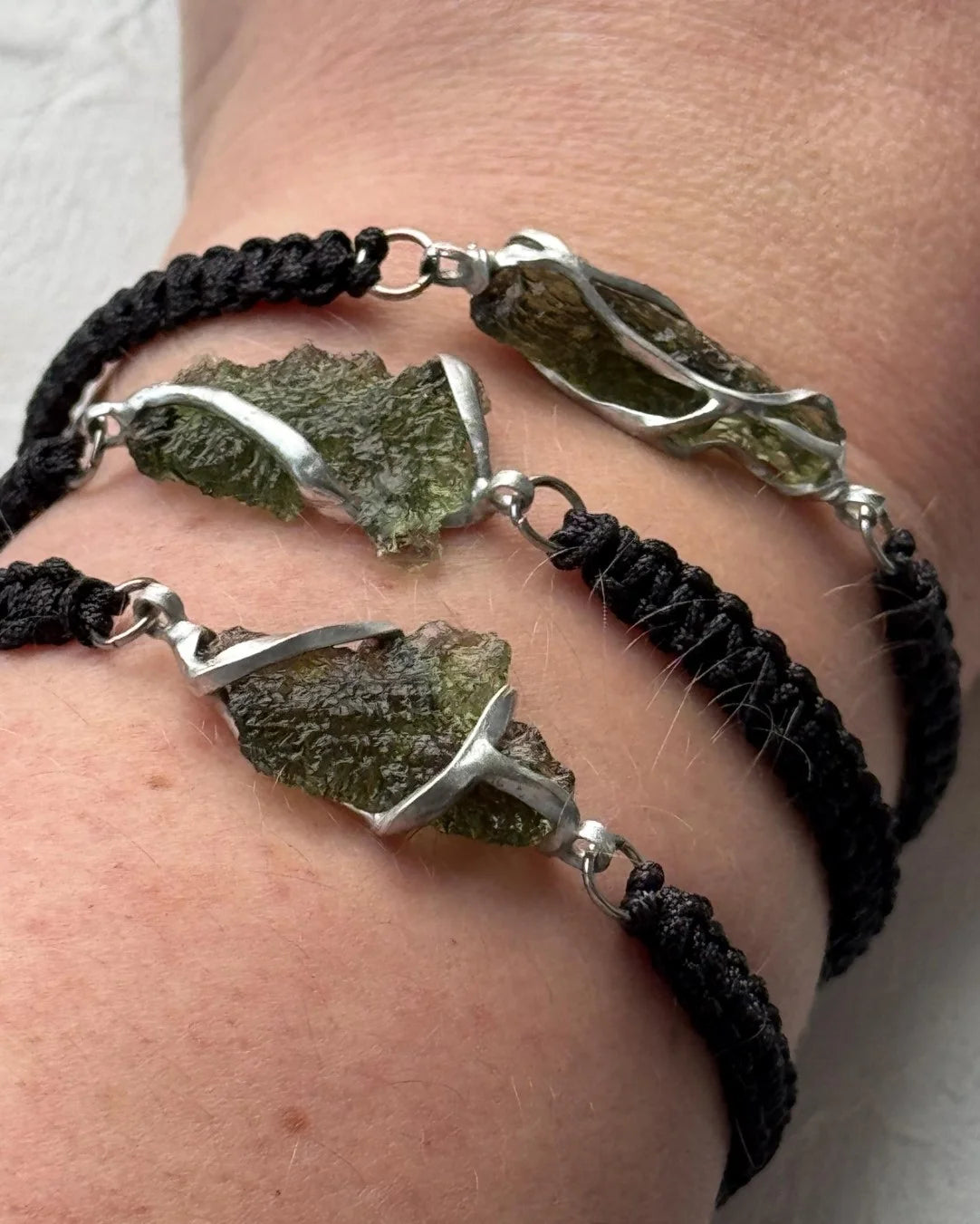 Moldavite bracelet with 1.2g transparent stone from Chlum on black braided cord
