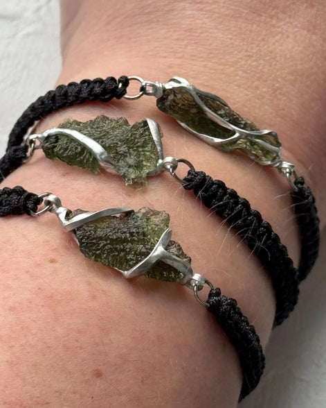 Moldavite bracelet with 1.2g transparent stone from Chlum on black braided cord