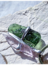 Pendant with 3.49g apple green moldavite from Ločenice and pale pink kunzite held by crossing metal bands.