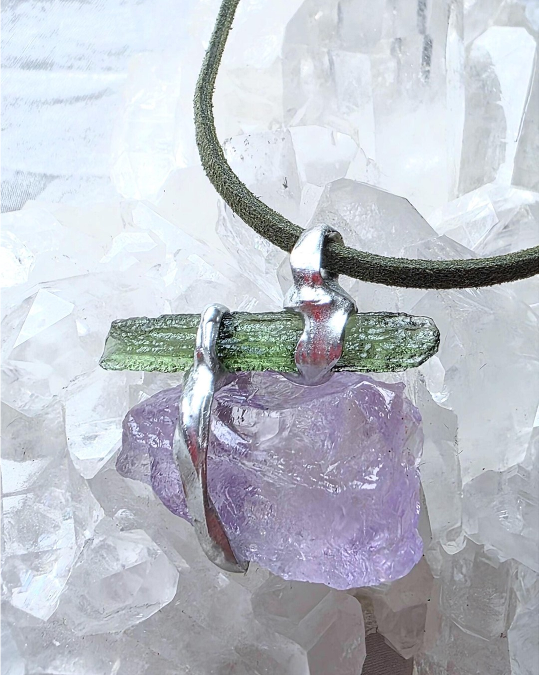 Handcrafted pendant with a 1.08g transparent green Moldavite from Chlum and Amethyst in a lead-free tin alloy setting with copper wire.