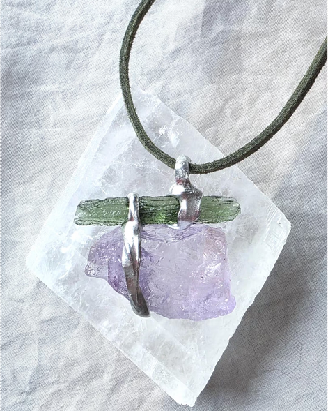 Handcrafted pendant with a 1.08g transparent green Moldavite from Chlum and Amethyst in a lead-free tin alloy setting with copper wire.