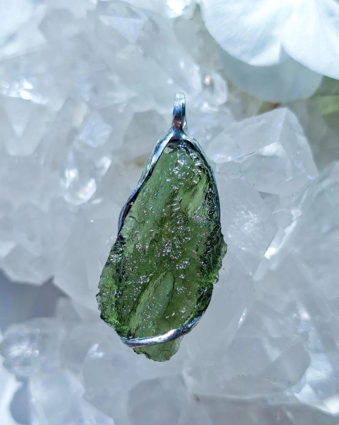 Transparent green Chlum Moldavite pendant in an open handcrafted setting
