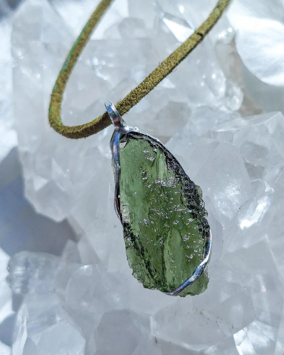 Transparent green Chlum Moldavite pendant in an open handcrafted setting
