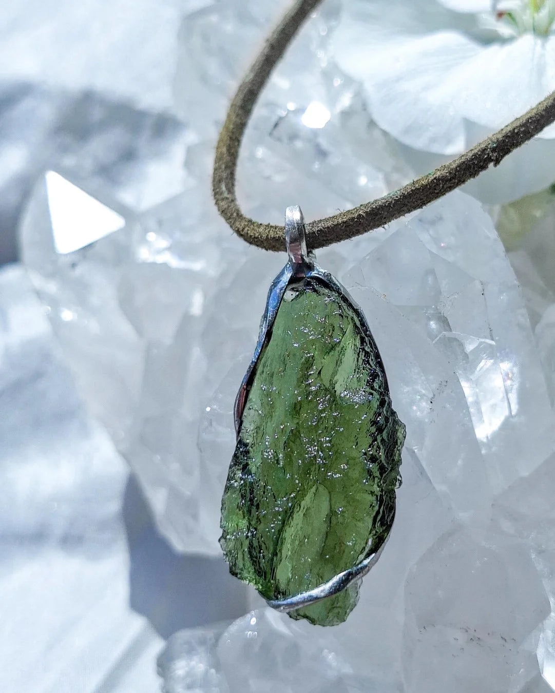Transparent green Chlum Moldavite pendant in an open handcrafted setting