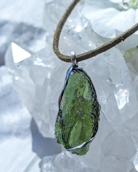 Transparent green Chlum Moldavite pendant in an open handcrafted setting