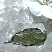 Transparent green Chlum Moldavite pendant in an open handcrafted setting