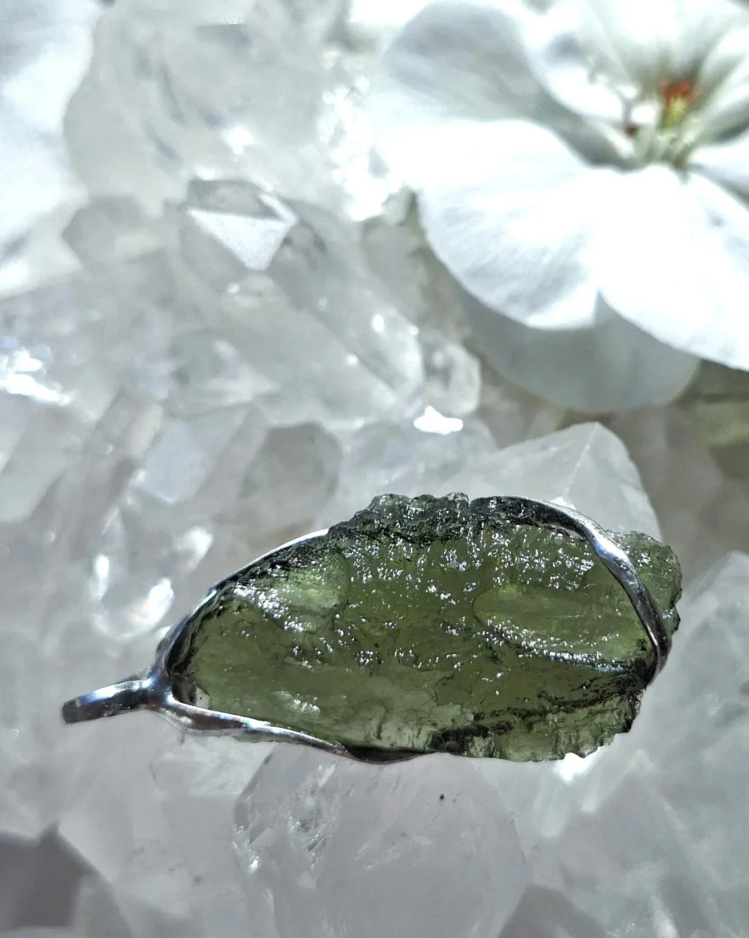 Transparent green Chlum Moldavite pendant in an open handcrafted setting